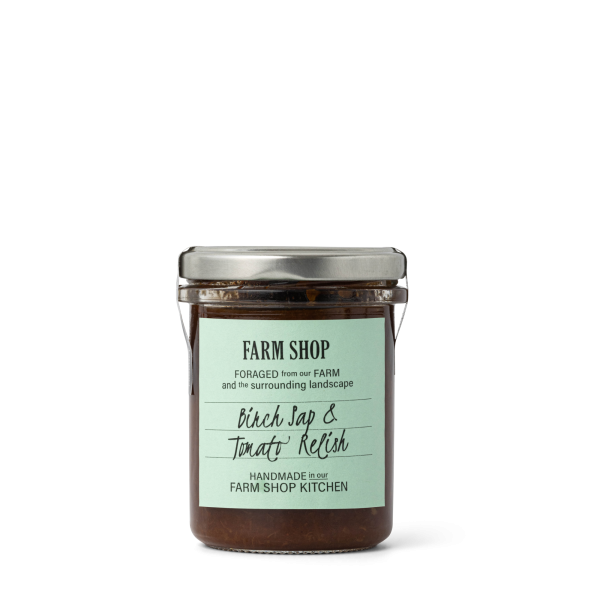 Farm shop birch sap and tomato relish in a jar with a green label