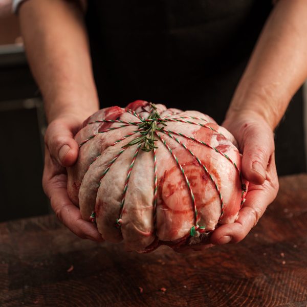 Lamb cushion held over a wooden table