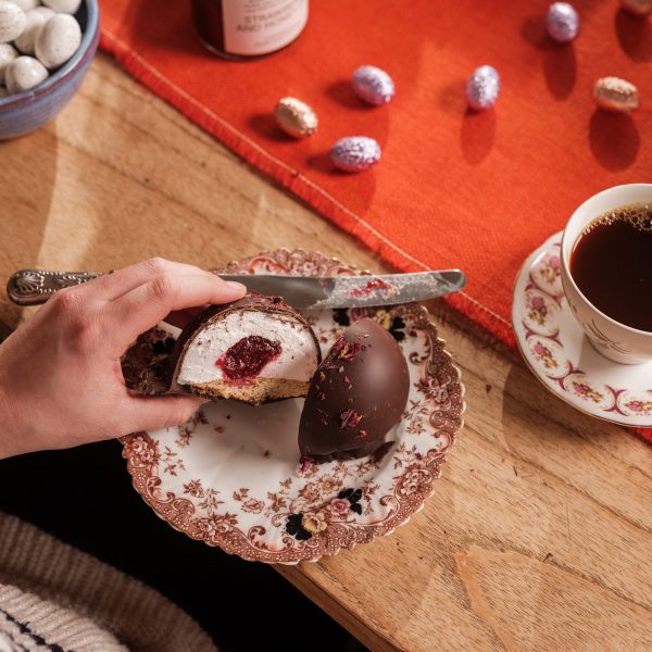 Raspberry jam teacake cut open on a plate