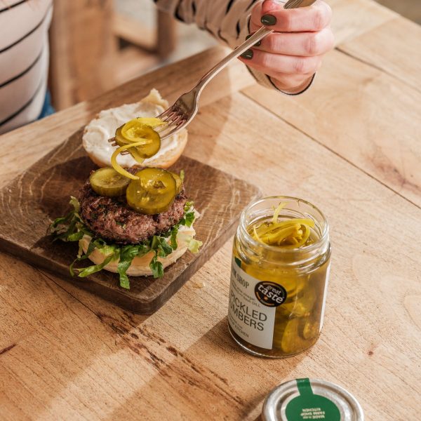 Dill pickled cucumbers on an open burger