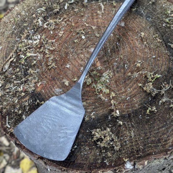Thorn wood forge bbq spatula on a tree stump